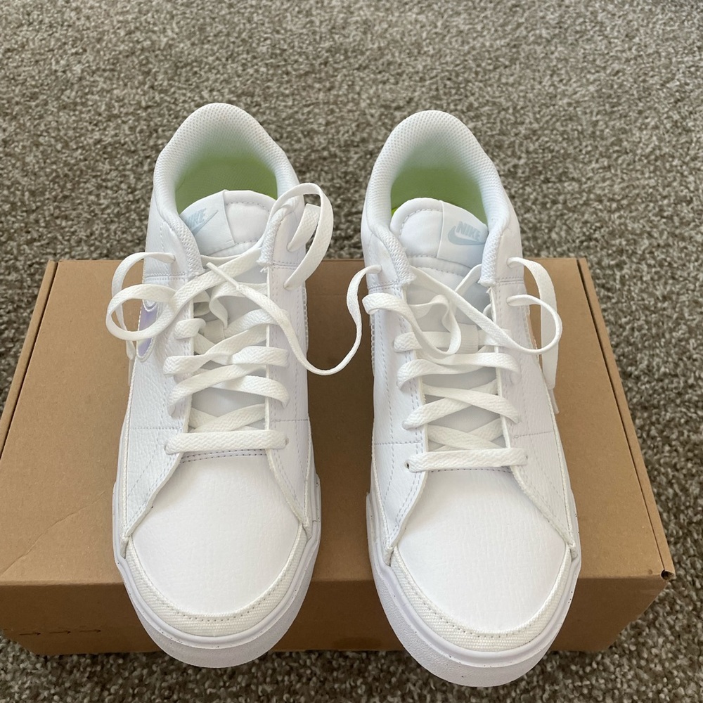 Brand new in box never worn women’s nike sneakers with metallic swoosh